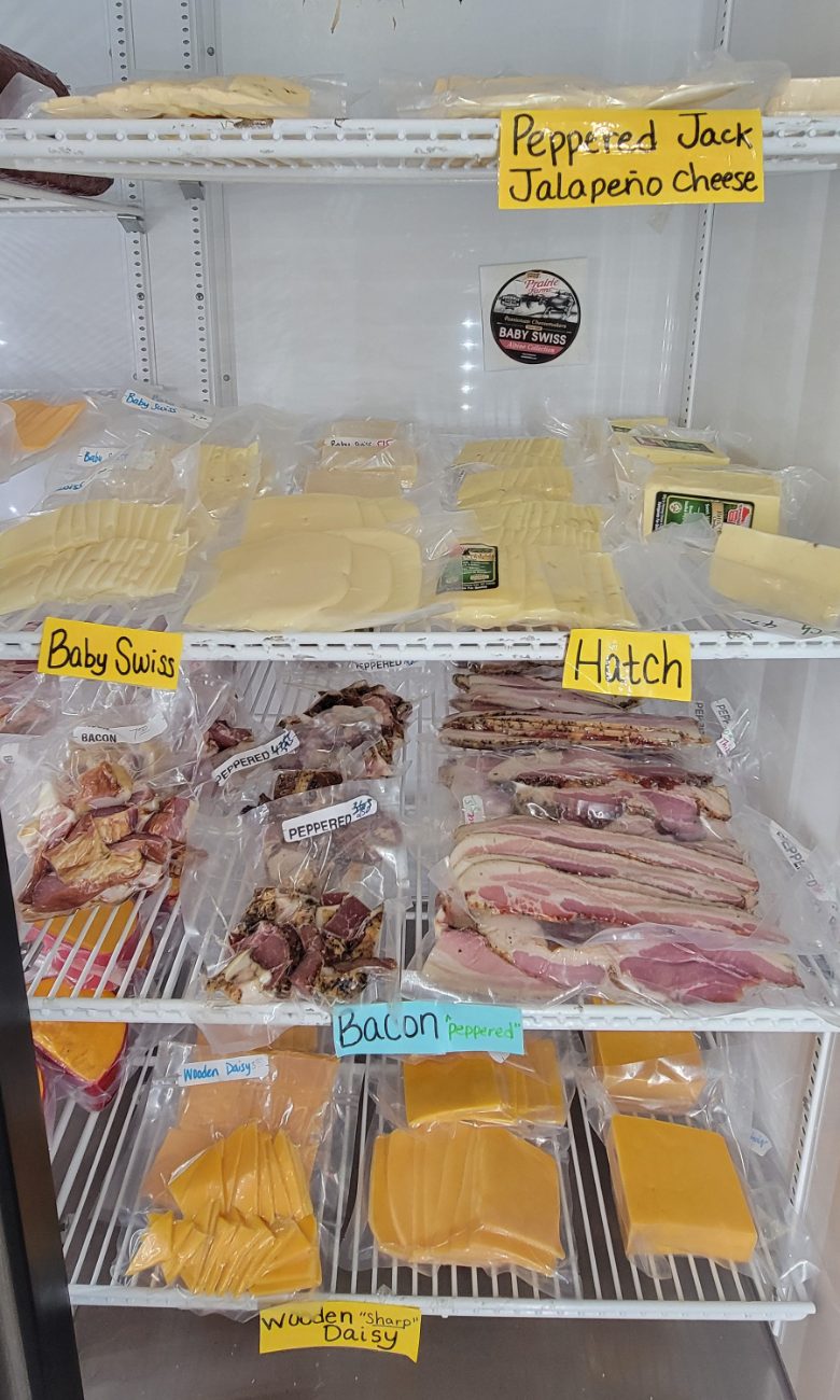 Cheese and bacon in the market display case
